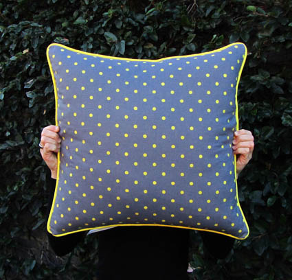 Grey cushions with yellow polka dots