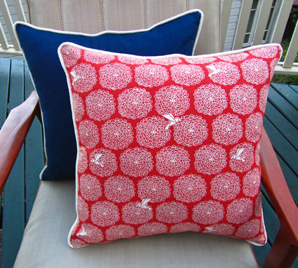 Origami birds cushions in red